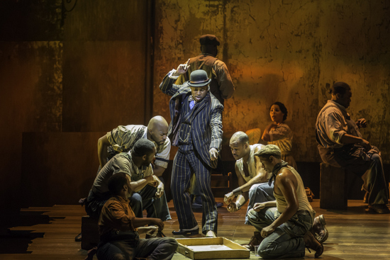 Kingsley Leggs as Sporting Life and the cast of The Gershwins’ Porgy and Bess. Photo by Michael J. Lutch.