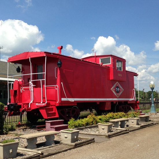 Red caboose near the Beckham Hotel in Mineola, Texas (photo by Tui Snider)