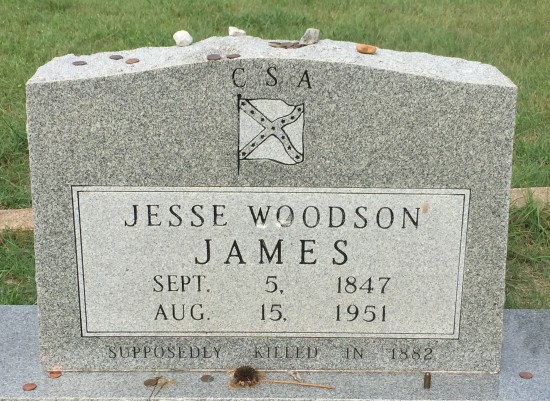 (c) Tui Snider - Visitors often leave coins on the grave of Jesse James in Granbury, TX